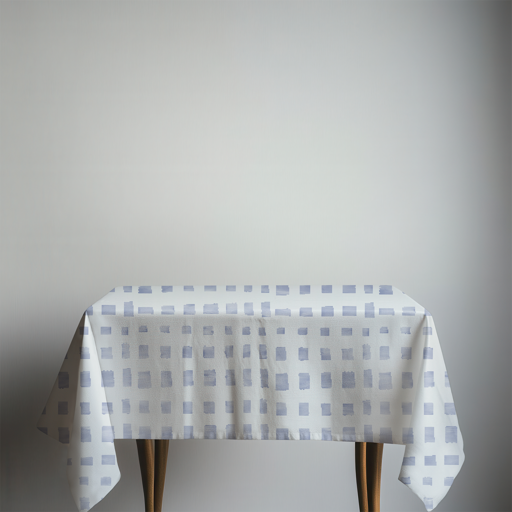 Table with a checkered tablecloth on a plain background