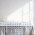 Tablecloth with a blue checkered pattern on a white background