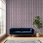 Blue sofa in a room with blue and pink patterned wallpaper
