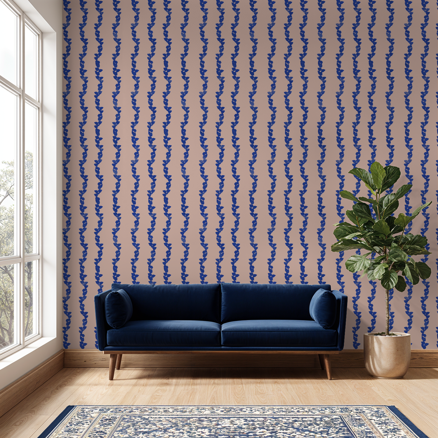 Blue sofa in a room with blue and pink patterned wallpaper