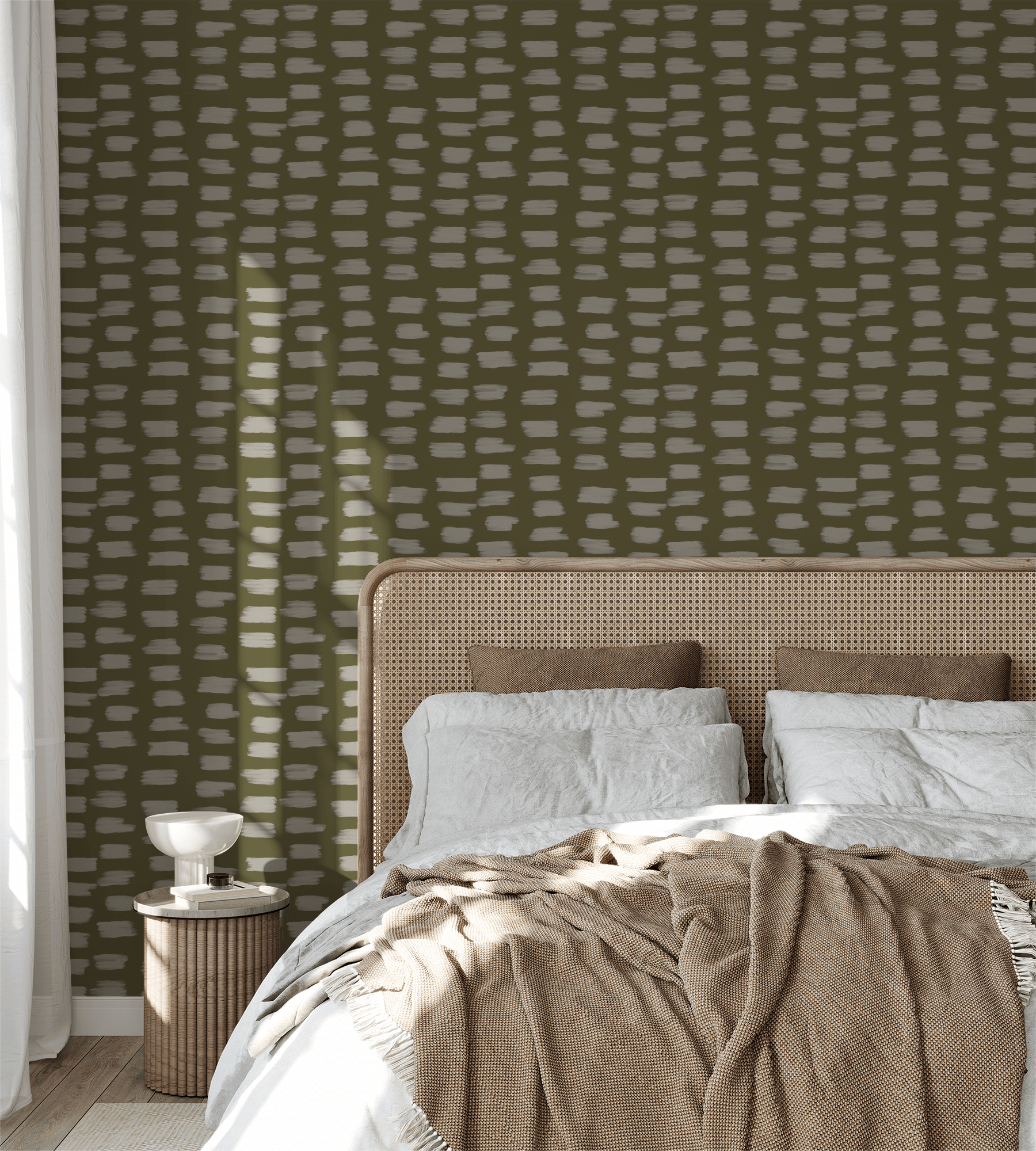 Bedroom with green patterned wallpaper and a bed with beige and white bedding.