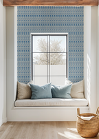 Scandi watercolor floral blue wallpaper in cozy window nook with cushions